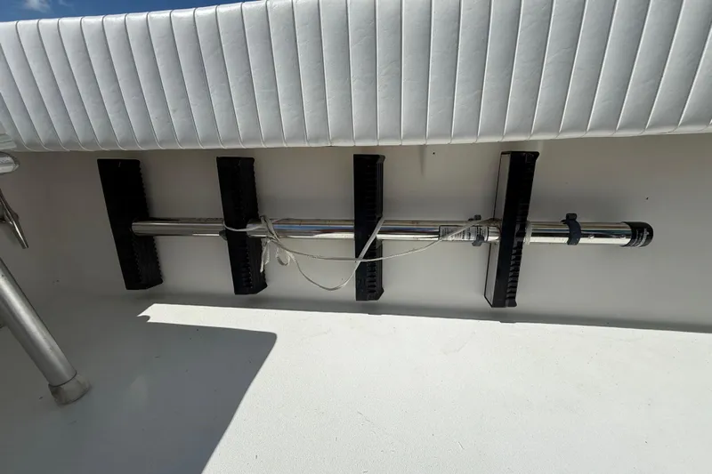  Yacht Photos Pics 2001 Regulator 32 Center Console boat interior with rod holder and cushioned seating.