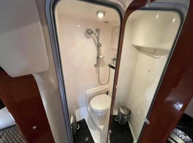  Yacht Photos Pics Bathroom interior of 2008 Regal 4060 COMMODORE yacht, featuring shower and toilet.