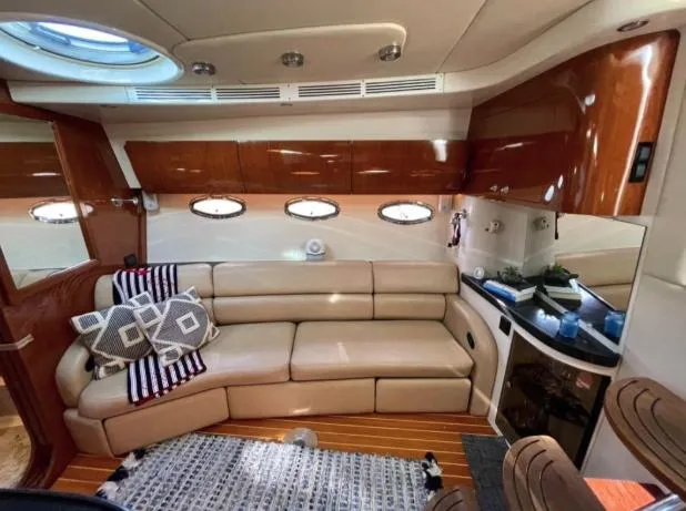  Yacht Photos Pics Luxurious interior of a 2008 Regal 4060 COMMODORE yacht with plush seating and elegant wood finishes.