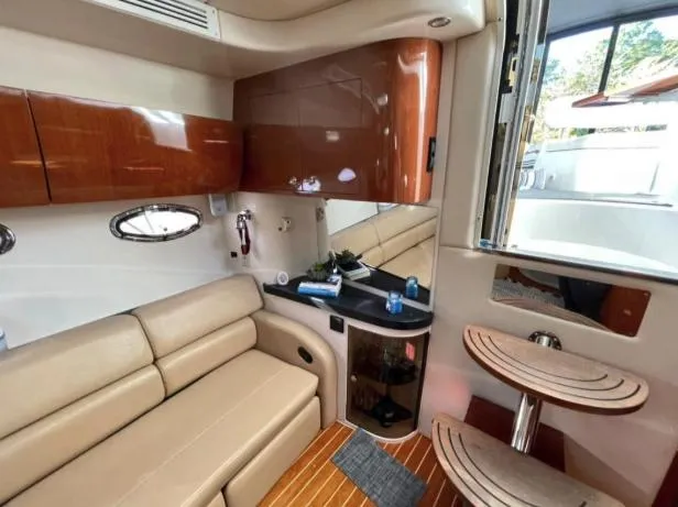  Yacht Photos Pics Interior of 2008 Regal 4060 COMMODORE yacht with beige seating and wooden cabinetry.