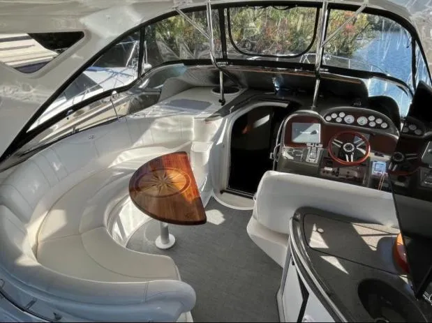  Yacht Photos Pics 2008 Regal 4060 COMMODORE yacht interior with plush seating and modern dashboard.