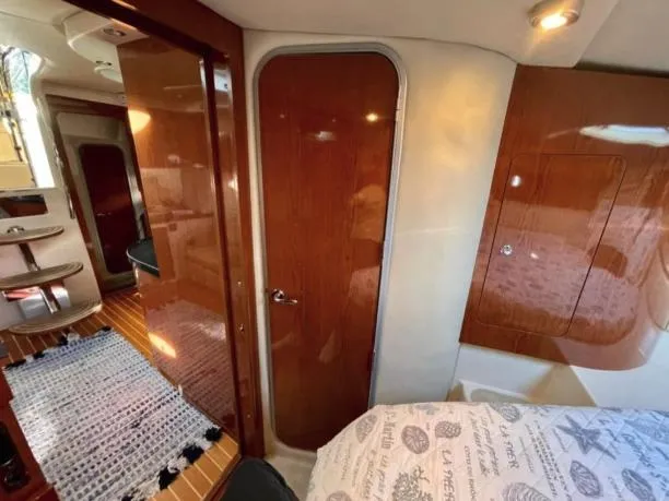  Yacht Photos Pics Interior of 2008 Regal 4060 COMMODORE yacht with wood paneling and cozy cabin.