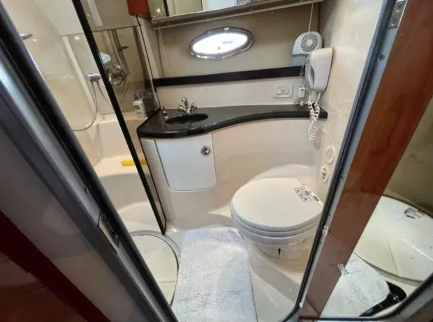  Yacht Photos Pics Bathroom interior of 2008 Regal 4060 COMMODORE yacht, featuring sink, toilet, and shower.
