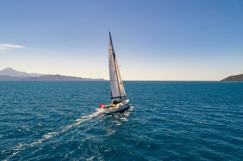  Yacht Photos Pics Amel 60 sailboat from 2021 on open sea under clear sky.