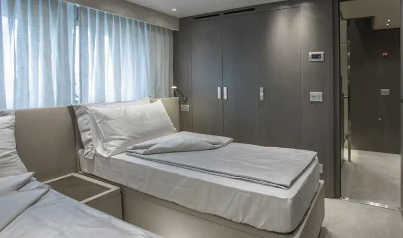  Yacht Photos Pics Luxurious cabin interior of 2016 Sanlorenzo SL96 yacht with twin beds and modern decor.