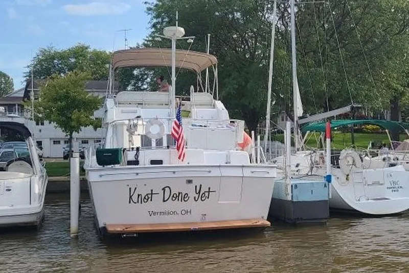 Knot Done Yet Yacht Photos Pics 2002 Mainship 430 Trawler docked, named "Knot Done Yet," in Vermilion, Ohio marina.