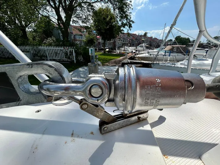 Knot Done Yet Yacht Photos Pics Close-up of a 2002 Mainship 430 Trawler's metal rigging component on deck.