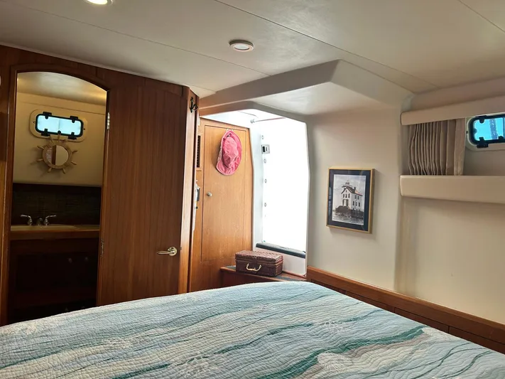 Knot Done Yet Yacht Photos Pics Interior of 2002 Mainship 430 Trawler with cozy bedroom and nautical decor.