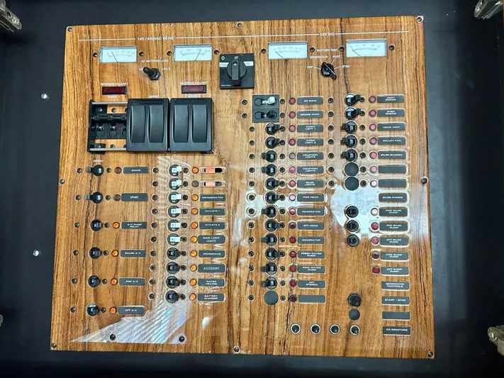 Knot Done Yet Yacht Photos Pics Control panel of a 2002 Mainship 430 Trawler with switches and gauges.