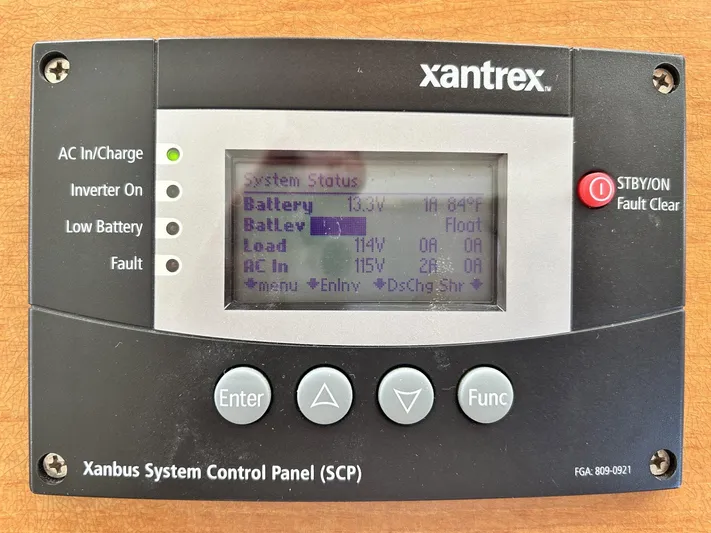 Knot Done Yet Yacht Photos Pics Xantrex Xanbus System Control Panel on 2002 Mainship 430 Trawler, displaying battery and system status.