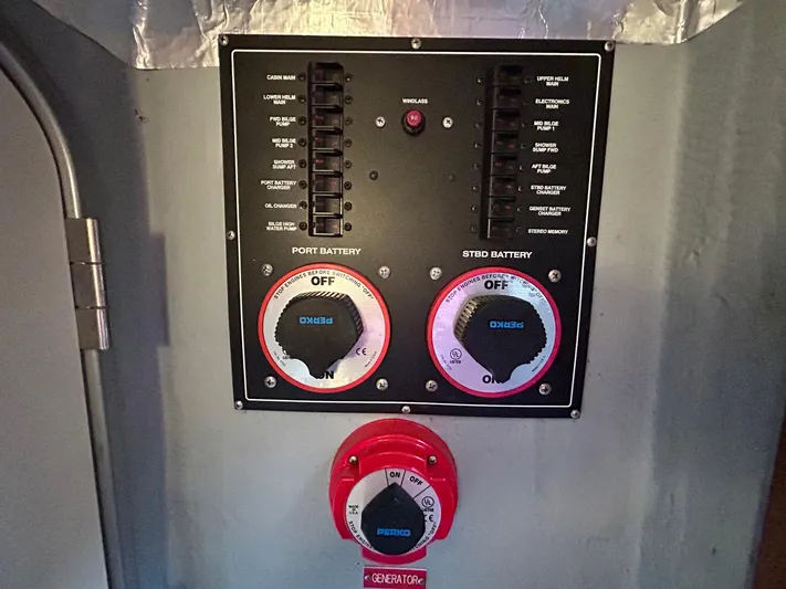 Knot Done Yet Yacht Photos Pics Control panel of a 2002 Mainship 430 Trawler with battery switches and circuit breakers.