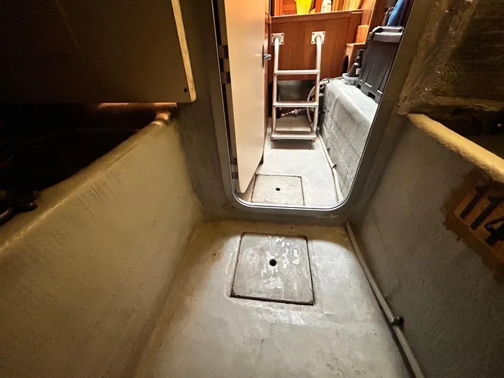 Knot Done Yet Yacht Photos Pics 2002 Mainship 430 Trawler interior with visible hatch and ladder.