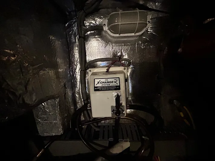 Knot Done Yet Yacht Photos Pics Engine room of 2002 Mainship 430 Trawler with oil change system.