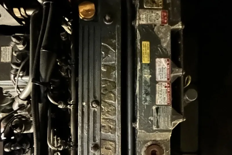 Knot Done Yet Yacht Photos Pics Engine compartment of a 2002 Mainship 430 Trawler, showing detailed mechanical components.