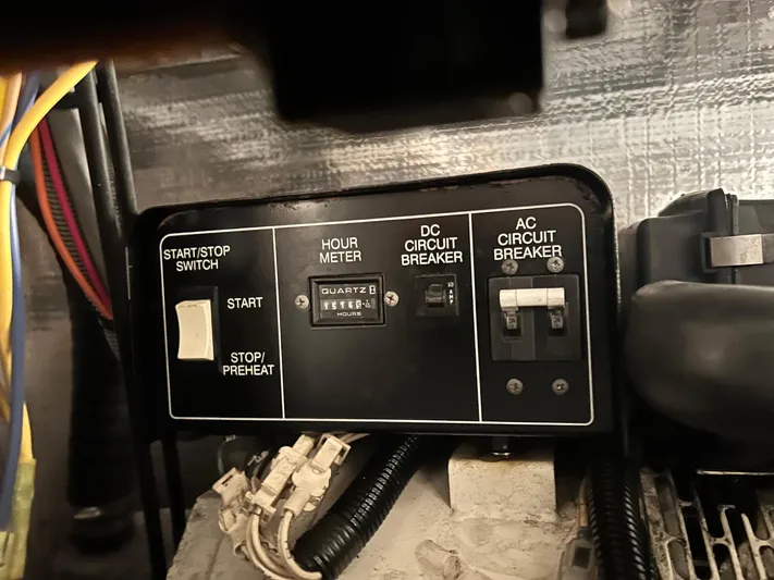 Knot Done Yet Yacht Photos Pics Control panel of a 2002 Mainship 430 Trawler with hour meter and circuit breakers.