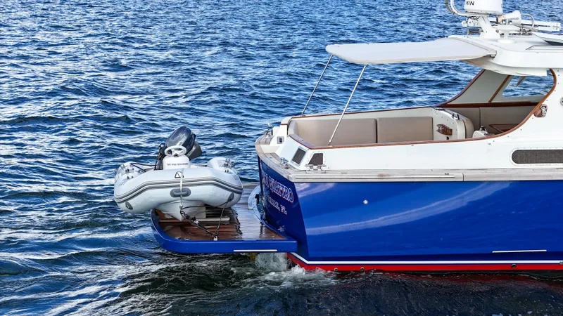 Noi Qauttro Yacht Photos Pics Custom 48 yacht with dinghy on water, 2010 model.