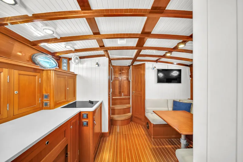Noi Qauttro Yacht Photos Pics Luxurious wooden interior of a 2010 Custom 48 yacht with modern amenities.