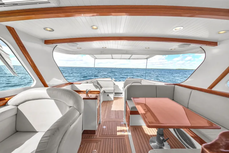 Noi Qauttro Yacht Photos Pics Luxurious 2010 Custom 48 yacht interior with ocean view, featuring elegant seating and wooden accents.