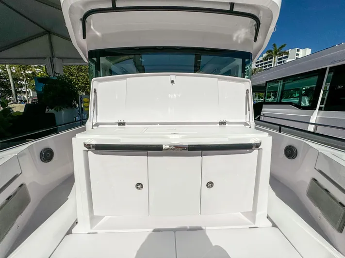  Yacht Photos Pics 2024 Axopar 37XC CROSS CABIN boat interior, featuring sleek white cabinetry and modern design.