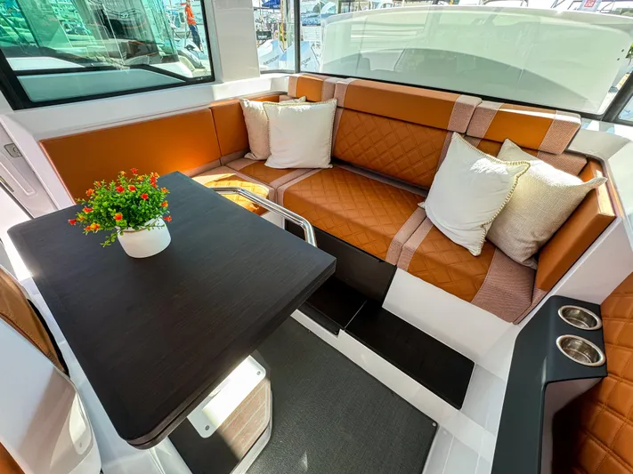  Yacht Photos Pics Luxurious interior of 2024 Axopar 37XC CROSS CABIN with plush seating and elegant table.