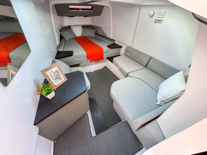  Yacht Photos Pics 2024 Axopar 37XC CROSS CABIN interior with cozy seating and modern decor.