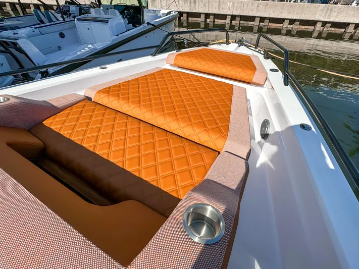  Yacht Photos Pics Luxurious orange seating on 2024 Axopar 37XC CROSS CABIN boat deck.
