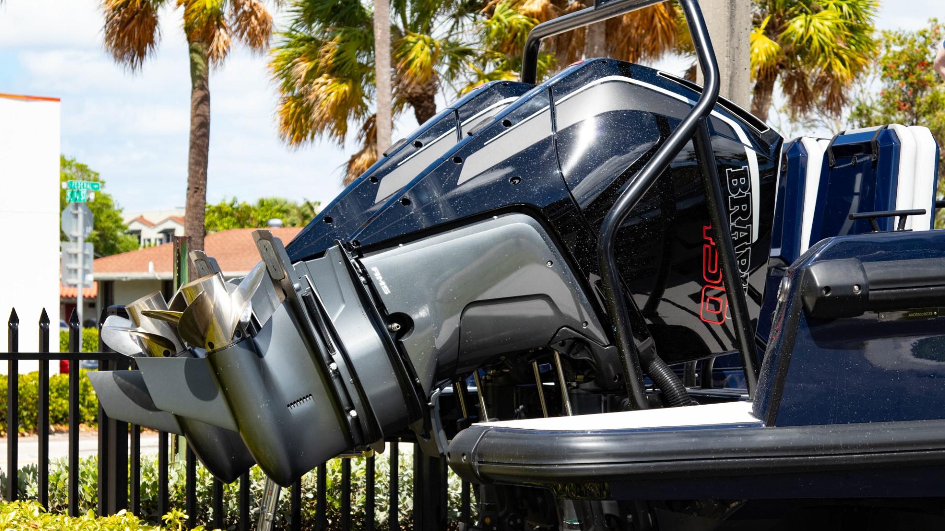 2023 BRABUS Shadow 900 ST outboard motor close-up with palm trees in the background.