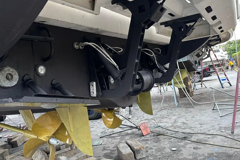  Yacht Photos Pics 2014 Azimut 54 yacht under maintenance, showcasing propellers and mechanical components.