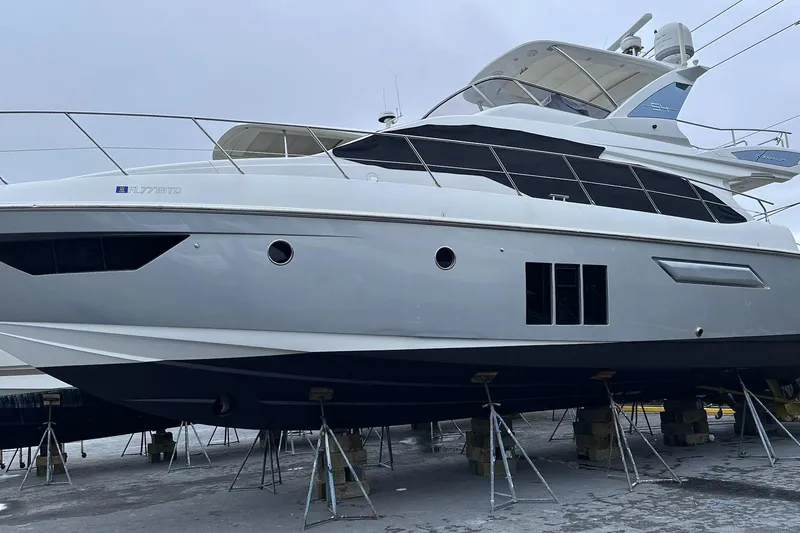  Yacht Photos Pics 2014 Azimut 54 yacht on dry dock, showcasing sleek design and modern features.
