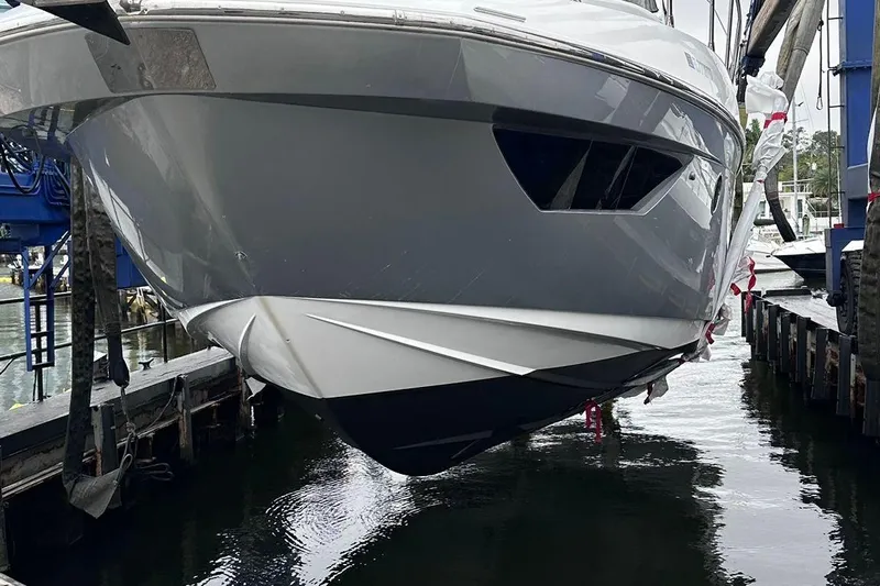  Yacht Photos Pics 2014 Azimut 54 yacht in dry dock, showcasing sleek hull design.
