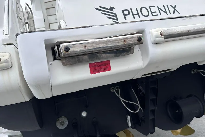  Yacht Photos Pics Rear view of 2014 Azimut 54 yacht named "Phoenix" with visible mechanical components.