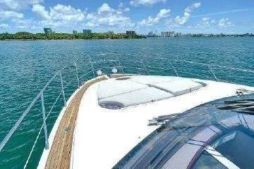  Yacht Photos Pics Azimut 54 yacht cruising on clear blue waters under a sunny sky, 2014 model.