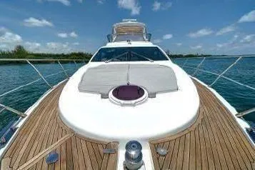  Yacht Photos Pics 2014 Azimut 54 yacht on water, showcasing sleek design and wooden deck.