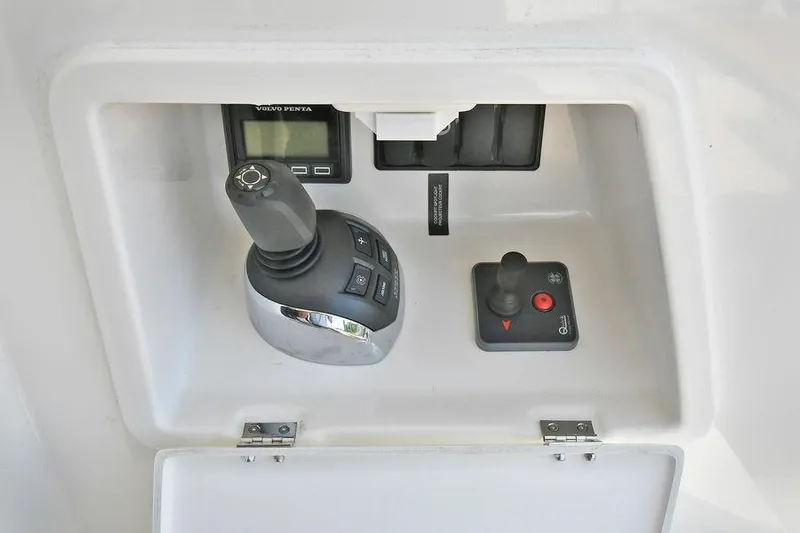  Yacht Photos Pics Control panel of a 2019 Prestige 460 yacht featuring joystick and digital display.