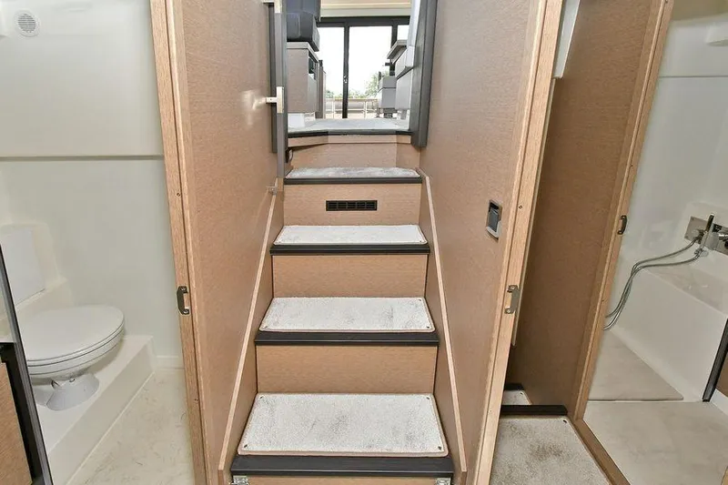  Yacht Photos Pics Interior of 2019 Prestige 460 yacht showing stairs, bathroom, and modern design elements.