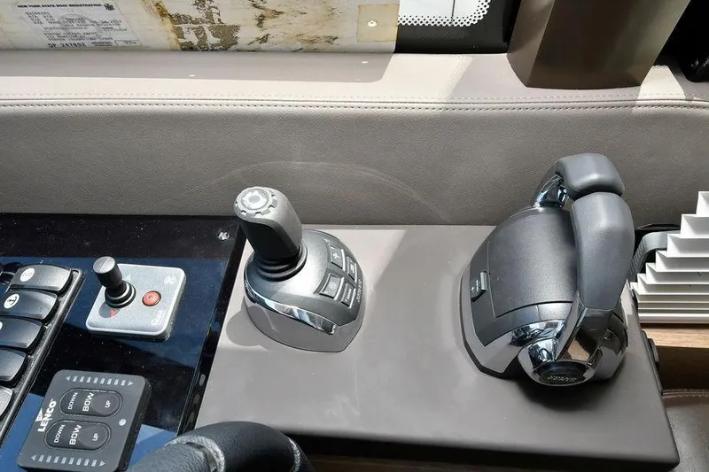 Yacht Photos Pics Control panel of a 2019 Prestige 460 yacht with joystick and throttle.
