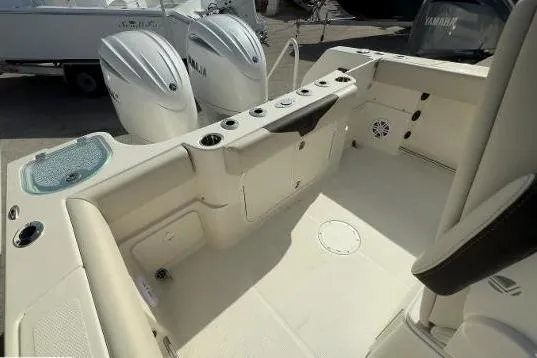 242-935 Yacht Photos Pics 2024 Sailfish 242 CC boat interior with dual Yamaha engines, featuring spacious seating and storage.