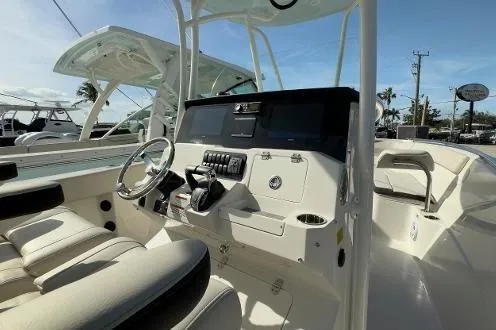 242-935 Yacht Photos Pics 2024 Sailfish 242 CC boat interior with modern helm and seating.