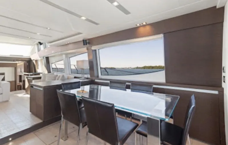 The Good Life Yacht Photos Pics Luxurious interior of 2015 Prestige 75 yacht with modern dining area and panoramic windows.