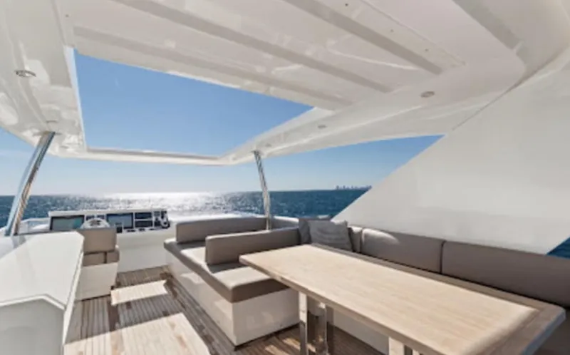 The Good Life Yacht Photos Pics Prestige 75 yacht 2015 model, spacious deck with seating and table, ocean view.
