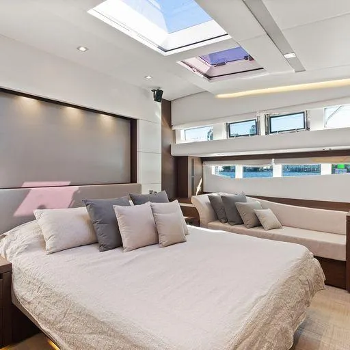 The Good Life Yacht Photos Pics Luxurious bedroom interior on a 2015 Prestige 75 yacht with skylight and modern decor.