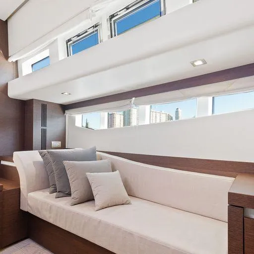 The Good Life Yacht Photos Pics Luxurious interior of a 2015 Prestige 75 yacht with modern seating and cushions.