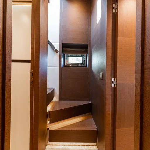 The Good Life Yacht Photos Pics Interior stairway of 2015 Prestige 75 yacht with modern wooden design.