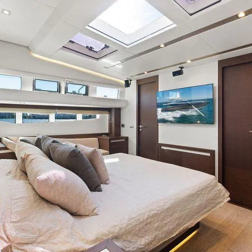 The Good Life Yacht Photos Pics Luxurious bedroom interior on a 2015 Prestige 75 yacht with skylight and modern decor.