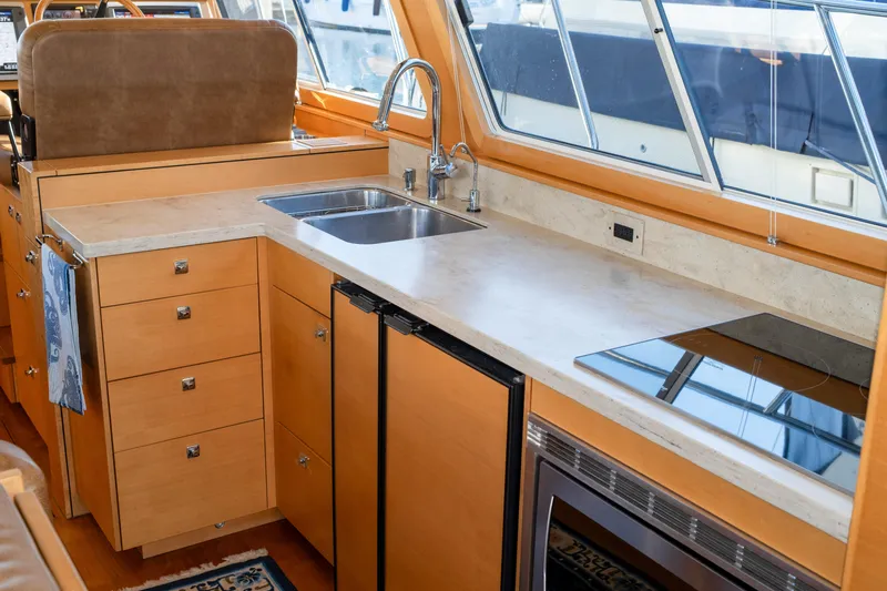 Alki Yacht Photos Pics Luxurious 2013 Coastal Craft 45 yacht kitchen with modern appliances and sleek design.