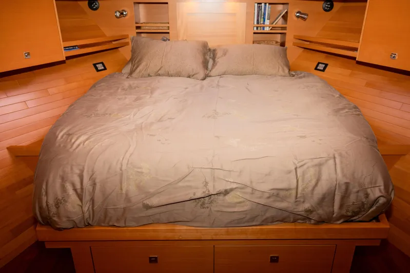Alki Yacht Photos Pics Luxurious bedroom interior of 2013 Coastal Craft 45 yacht with wooden accents and cozy bedding.
