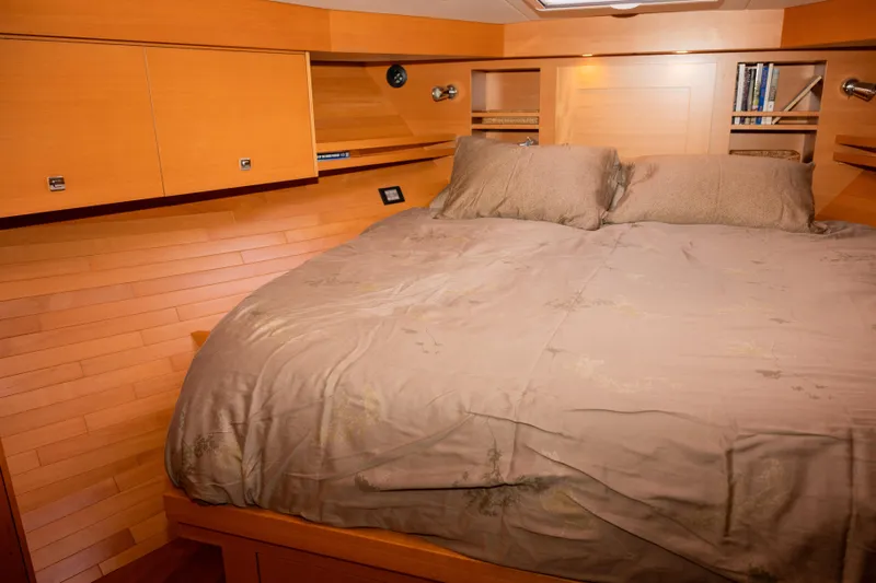 Alki Yacht Photos Pics Cozy bedroom interior of 2013 Coastal Craft 45 yacht with wooden paneling and plush bedding.