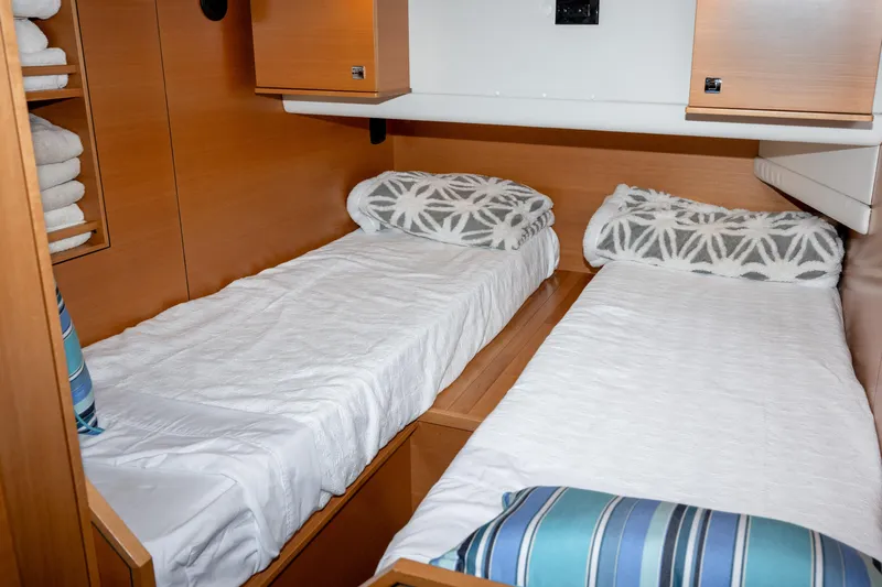 Alki Yacht Photos Pics Interior of 2013 Coastal Craft 45 yacht with twin beds and wooden cabinetry.