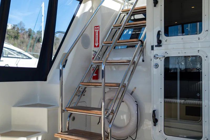 Alki Yacht Photos Pics Stainless steel and wood stairs on 2013 Coastal Craft 45 yacht interior.