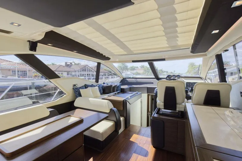 Encore Yacht Photos Pics Luxurious interior of a 2015 Azimut 55S yacht with modern furnishings and panoramic windows.